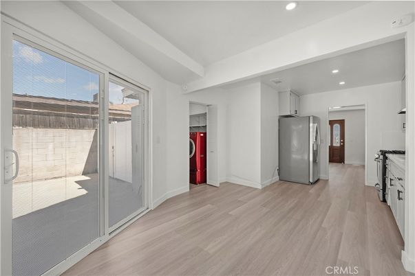 Interior, Kitchen, Recessed Lighting, Washer, Wood Texture Flooring