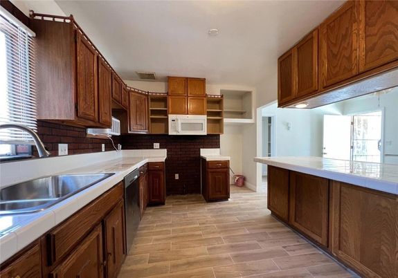 Interior, Kitchen, Tile Countertops, Wood Texture Flooring