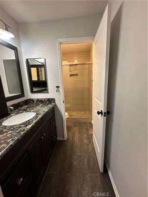Bathroom, Dual Sink Vanities, Glass Shower, Interior, Wood Texture Flooring