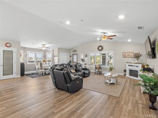 Dining room, Fireplace, Interior, Living room, Recessed Lighting, Wood Texture Flooring
