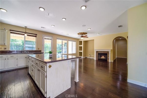 Empty room, Fireplace, Interior, Kitchen, Recessed Lighting, Wood Texture Flooring