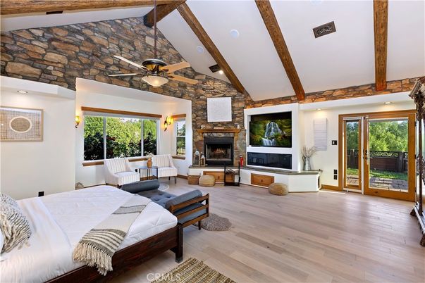 Bedroom, Fireplace, Interior, Recessed Lighting, Stone Walls, Wooden Beams, Wood Texture Flooring
