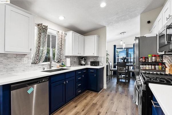 Dining room, Interior, Kitchen, Pendant Lights, Recessed Lighting, Stainless Steel Appliances, Wood Texture Flooring