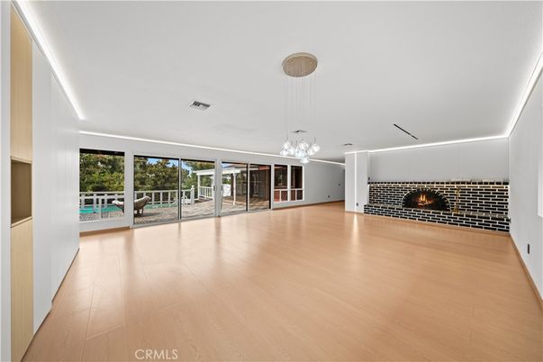 Empty room, Fireplace, Interior, Pendant Lights, Wood Texture Flooring