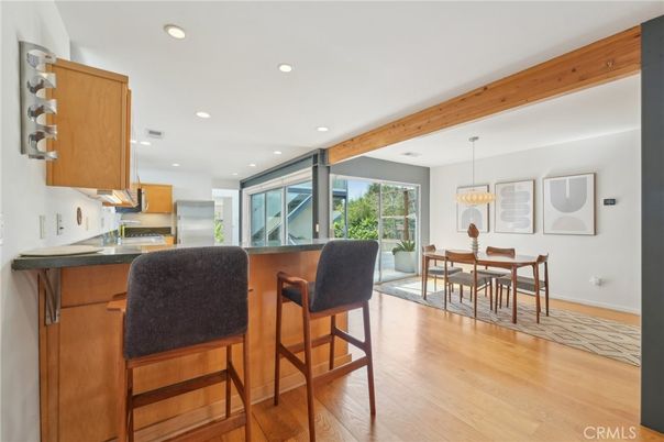 Chandelier, Dining room, Interior, Kitchen, Pendant Lights, Recessed Lighting, Stainless Steel Appliances, Wooden Beams, Wood Texture Flooring
