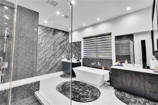 Bathroom, Dual Sink Vanities, Free Standing Baths, Glass Shower, Interior, Marble Walls, Recessed Lighting