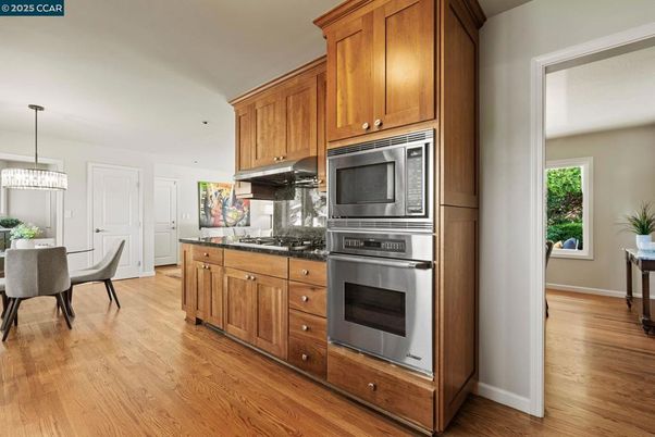 Dining room, Interior, Kitchen, Pendant Lights, Stainless Steel Appliances, Wood Texture Flooring