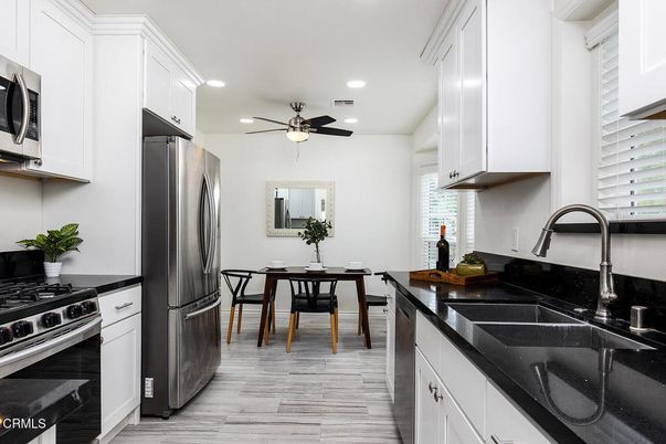 Dining room, Interior, Kitchen, Recessed Lighting, Stainless Steel Appliances, Wood Texture Flooring