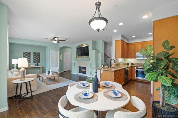 Dining room, Fireplace, Interior, Kitchen, Living room, Recessed Lighting, Stainless Steel Appliances, Wood Texture Flooring