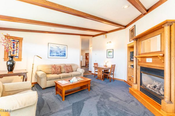 Dining room, Fireplace, Interior, Living room, Recessed Lighting, Wooden Beams