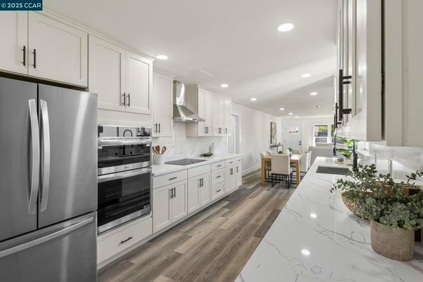 Dining room, Interior, Kitchen, Recessed Lighting, Stainless Steel Appliances, Wood Texture Flooring