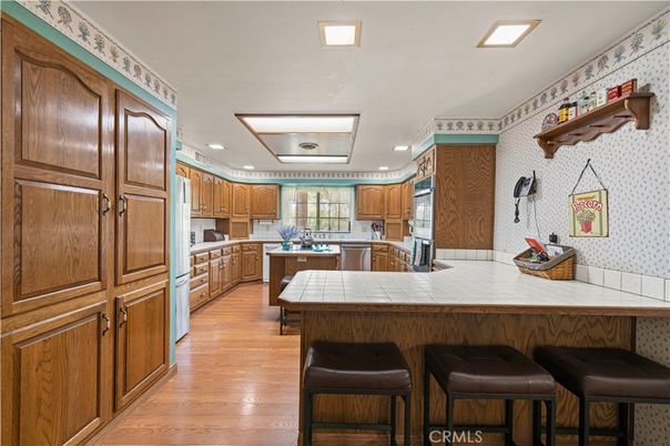 Interior, Kitchen, Recessed Lighting, Tile Countertops, Wood Texture Flooring