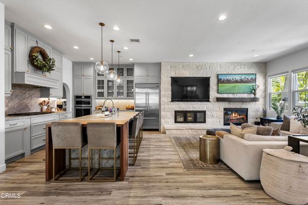 Fireplace, Interior, Kitchen, Living room, Pendant Lights, Recessed Lighting, Stainless Steel Appliances, Wood Texture Flooring