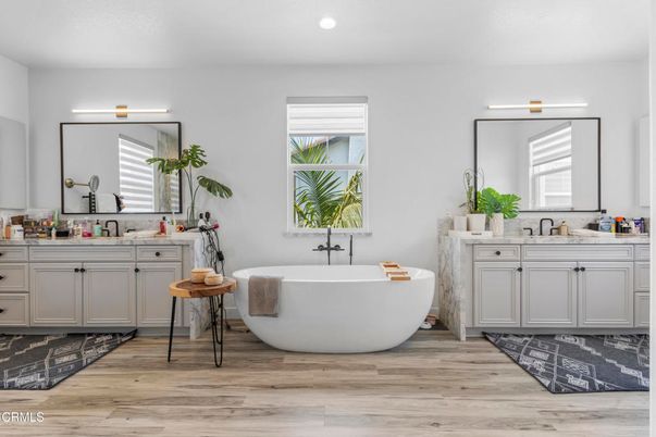 Bathroom, Dual Sink Vanities, Free Standing Baths, Interior, Recessed Lighting, Wood Texture Flooring