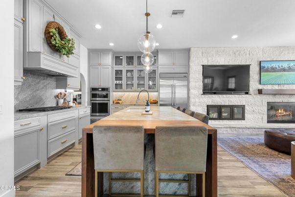 Fireplace, Interior, Kitchen, Pendant Lights, Recessed Lighting, Stainless Steel Appliances, Wood Texture Flooring