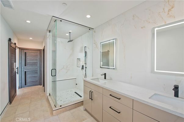 Bathroom, Dual Sink Vanities, Glass Shower, Interior, Marble Walls, Recessed Lighting