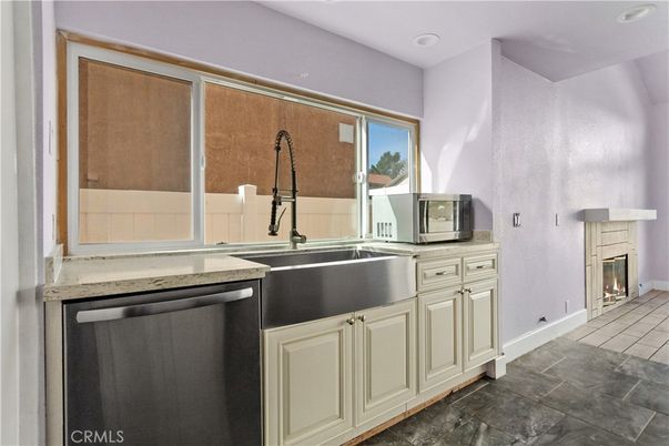 Fireplace, Interior, Kitchen, Recessed Lighting, Stainless Steel Appliances