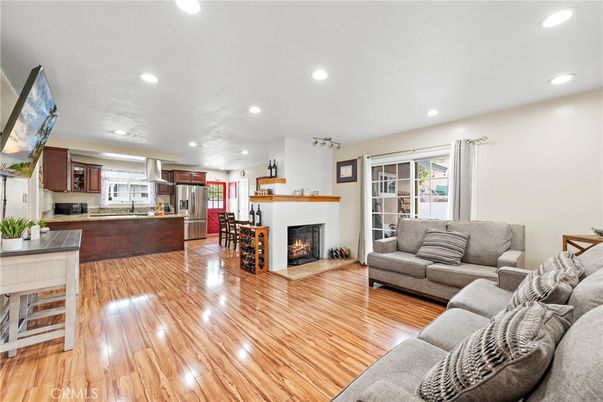 Fireplace, Interior, Kitchen, Living room, Recessed Lighting, Stainless Steel Appliances, Wood Texture Flooring