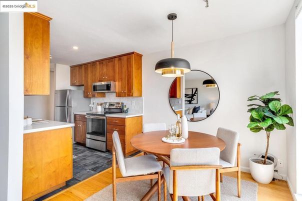 Dining room, Interior, Kitchen, Pendant Lights, Recessed Lighting, Stainless Steel Appliances, Wood Texture Flooring