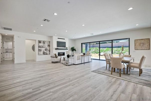 Dining room, Fireplace, Interior, Living room, Recessed Lighting, Wood Texture Flooring