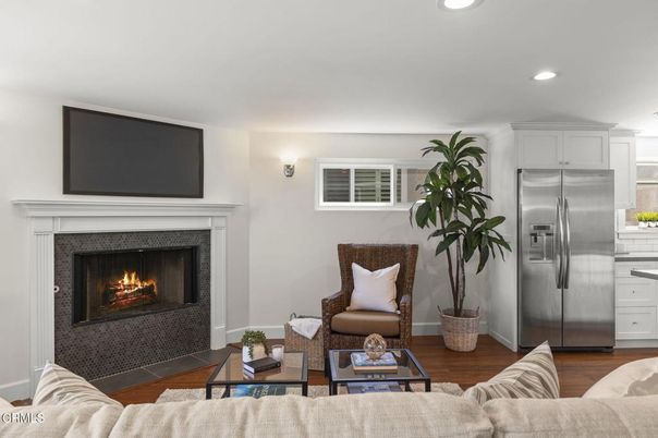 Fireplace, Interior, Kitchen, Living room, Recessed Lighting, Stainless Steel Appliances, Wood Texture Flooring