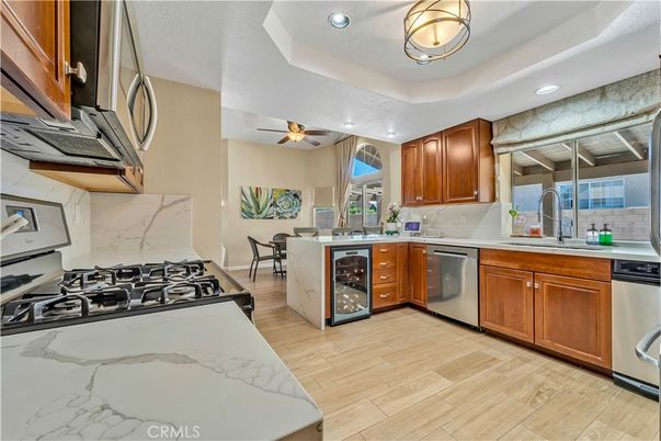 Dining room, Interior, Kitchen, Recessed Lighting, Stainless Steel Appliances, Wood Texture Flooring