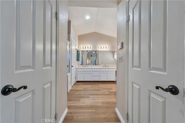Bathroom, Dual Sink Vanities, Interior, Recessed Lighting, Wood Texture Flooring