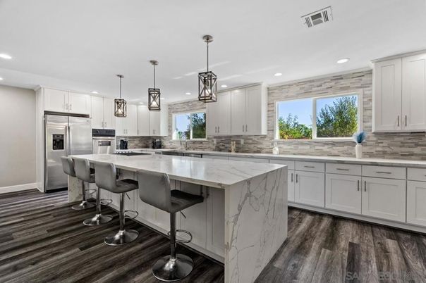 Interior, Kitchen, Marble Walls, Pendant Lights, Recessed Lighting, Stainless Steel Appliances, Wood Texture Flooring