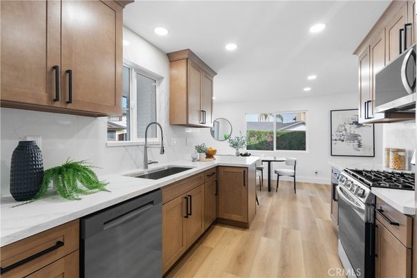 Dining room, Interior, Kitchen, Recessed Lighting, Stainless Steel Appliances, Wood Texture Flooring
