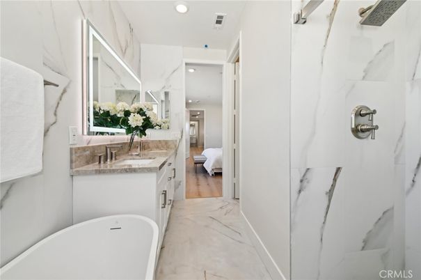 Bathroom, Free Standing Baths, Interior, Marble, Marble Walls, Recessed Lighting, Wood Texture Flooring