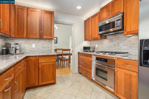 Dining room, Interior, Kitchen, Recessed Lighting, Stainless Steel Appliances, Wood Texture Flooring