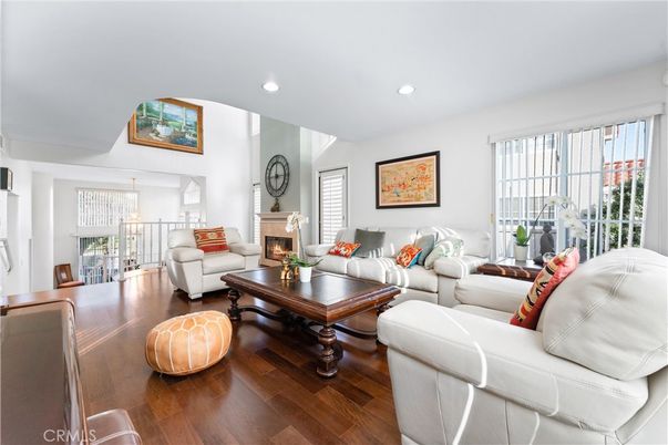 Dining room, Fireplace, Interior, Living room, Recessed Lighting, Wood Texture Flooring