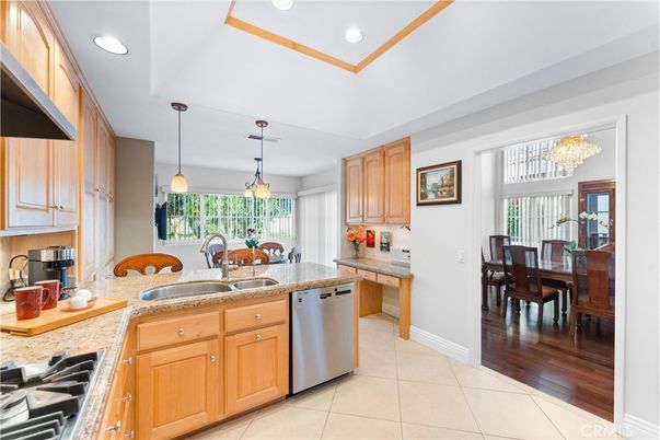 Chandelier, Dining room, Interior, Kitchen, Pendant Lights, Recessed Lighting, Stainless Steel Appliances, Wood Texture Flooring