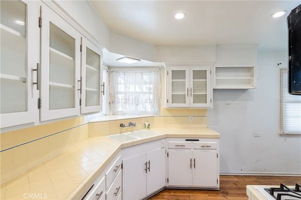 Interior, Kitchen, Recessed Lighting, Tile Countertops, Wood Texture Flooring