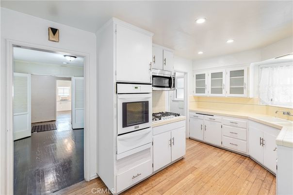 Interior, Kitchen, Recessed Lighting, Tile Countertops, Wood Texture Flooring