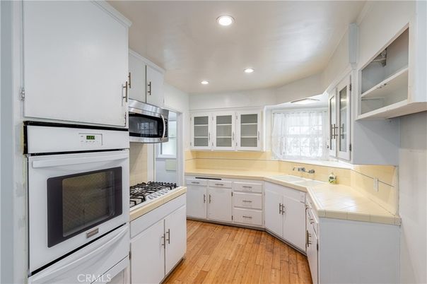 Interior, Kitchen, Recessed Lighting, Tile Countertops, Wood Texture Flooring