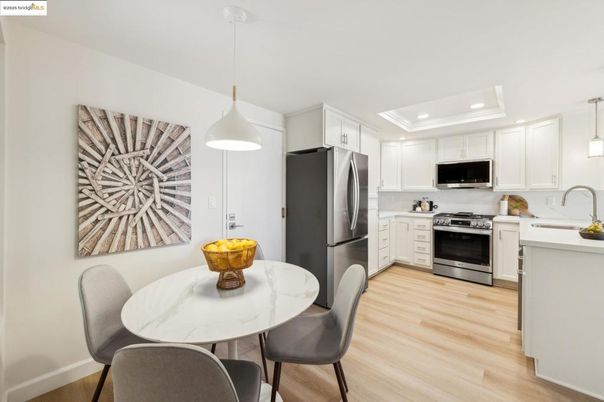 Dining room, Interior, Kitchen, Pendant Lights, Recessed Lighting, Stainless Steel Appliances, Wood Texture Flooring