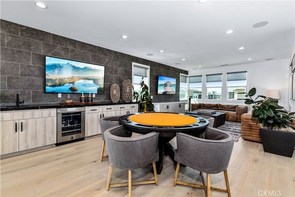 Dining room, Game Room, Interior, Kitchen, Living room, Recessed Lighting, Stainless Steel Appliances, Wood Texture Flooring