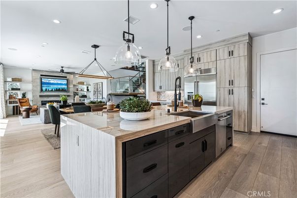 Dining room, Fireplace, Interior, Kitchen, Living room, Pendant Lights, Recessed Lighting, Stainless Steel Appliances, Wood Texture Flooring