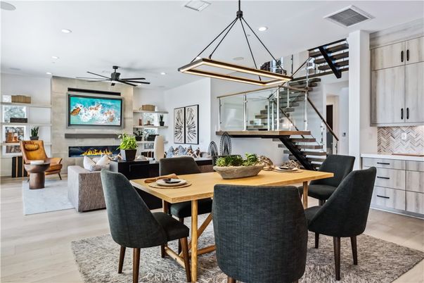 Dining room, Fireplace, Interior, Living room, Pendant Lights, Recessed Lighting, Wood Texture Flooring