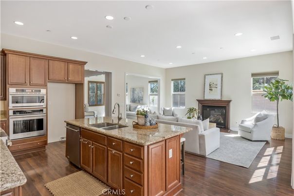 Fireplace, Interior, Kitchen, Living room, Recessed Lighting, Stainless Steel Appliances, Wood Texture Flooring