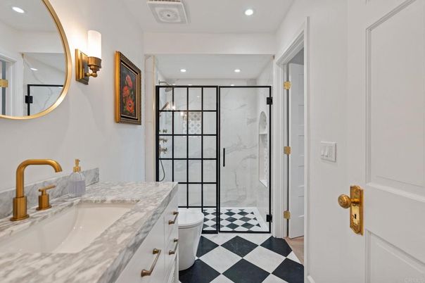 Bathroom, Dual Sink Vanities, Glass Shower, Interior, Marble, Marble Walls, Recessed Lighting