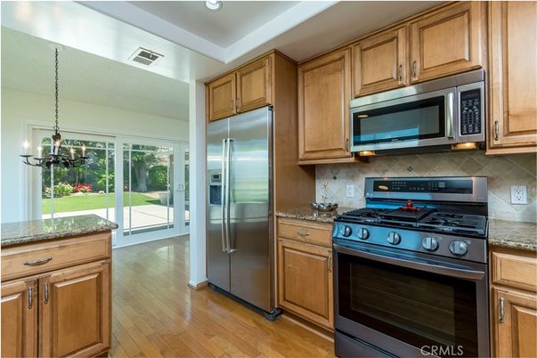 Chandelier, Interior, Kitchen, Pendant Lights, Recessed Lighting, Stainless Steel Appliances, Wood Texture Flooring