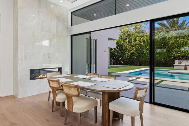 Dining room, Fireplace, Interior, Pool, Recessed Lighting, Wood Texture Flooring