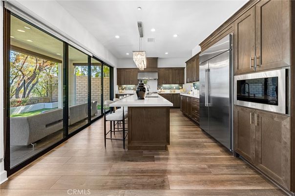 Chandelier, Interior, Kitchen, Pendant Lights, Recessed Lighting, Stainless Steel Appliances, Wood Texture Flooring