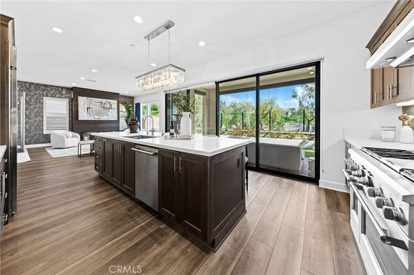 Chandelier, Interior, Kitchen, Living room, Pendant Lights, Recessed Lighting, Stainless Steel Appliances, Wood Texture Flooring
