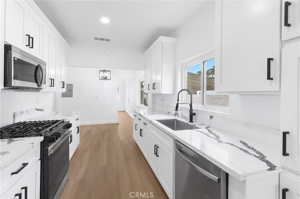 Interior, Kitchen, Recessed Lighting, Stainless Steel Appliances, Wood Texture Flooring