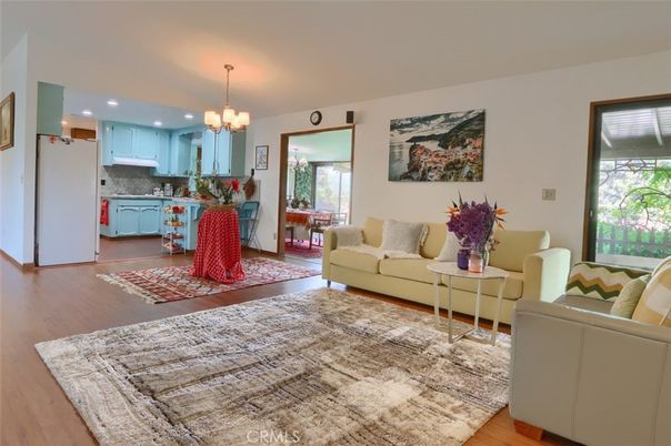 Chandelier, Dining room, Interior, Kitchen, Living room, Pendant Lights, Recessed Lighting, Stainless Steel Appliances, Wood Texture Flooring
