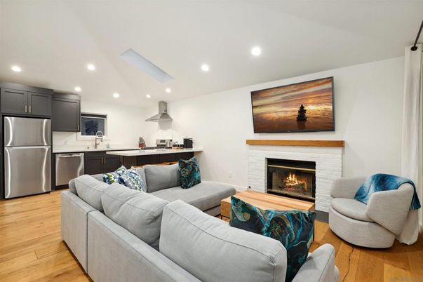 Fireplace, Interior, Kitchen, Living room, Recessed Lighting, Stainless Steel Appliances, Wood Texture Flooring