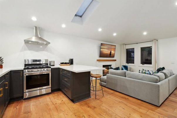 Fireplace, Interior, Kitchen, Living room, Recessed Lighting, Stainless Steel Appliances, Wood Texture Flooring